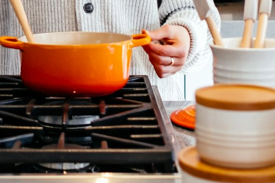 woman cooking inside kitchen room